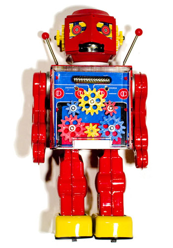 A classic sixties-era retro-style diecast metal toy robot, with visible gears in its chest cavity